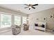 Bright Bedroom with two chairs, a crib, and a ceiling fan, creating a warm and inviting space at 1001 Medinah Ct, Waxhaw, NC 28173