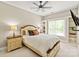 Comfortable bedroom featuring a ceiling fan, and bright natural light from the windows at 1001 Medinah Ct, Waxhaw, NC 28173