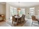 A formal dining room filled with natural light, perfect for entertaining, features large bay windows at 1001 Medinah Ct, Waxhaw, NC 28173