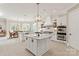 Spacious kitchen with white cabinetry, marble island, and stainless steel appliances, perfect for entertaining at 1001 Medinah Ct, Waxhaw, NC 28173