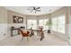 Bright and airy office space with wainscotting, large windows, and a ceiling fan at 1001 Medinah Ct, Waxhaw, NC 28173