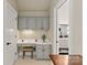 Charming office nook features a built-in desk, overhead cabinets, and a view into the bathroom at 1001 Medinah Ct, Waxhaw, NC 28173