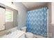 Standard bathroom featuring a single sink vanity and a shower/tub combination with an interesting curtain at 1018 Autumn Ln, Hickory, NC 28602