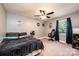 Bedroom featuring a ceiling fan, neutral walls, carpet, and window providing natural light at 1018 Autumn Ln, Hickory, NC 28602