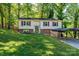Charming split-level home with red shutters, a brick foundation, and a convenient carport at 1018 Autumn Ln, Hickory, NC 28602