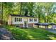 Charming split-level home with red shutters, carport and lovely landscaping at 1018 Autumn Ln, Hickory, NC 28602