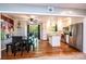 Open kitchen layout with a stainless steel refrigerator, island and wood floors at 1018 Autumn Ln, Hickory, NC 28602