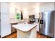 Clean, updated kitchen with stainless appliances and a kitchen island with white cabinets at 1018 Autumn Ln, Hickory, NC 28602