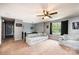 Open living area featuring plush sofa and chair next to large, bright windows at 1018 Autumn Ln, Hickory, NC 28602
