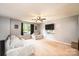 Bright living room featuring a ceiling fan, plush seating and wall mounted television at 1018 Autumn Ln, Hickory, NC 28602
