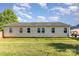 Expansive backyard showcasing the home's rear exterior and verdant lawn at 106 Rainbow Sw St, Concord, NC 28025