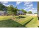 Large, well-maintained backyard with vibrant green grass and a sturdy wooden fence at 106 Rainbow Sw St, Concord, NC 28025