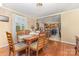 Cozy dining room adjacent to kitchen features wood floors and ample natural light at 106 Rainbow Sw St, Concord, NC 28025