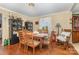 Charming dining room features wood floors, window, and classic decor at 106 Rainbow Sw St, Concord, NC 28025