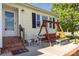 Charming front porch with seating, a swing, and brick steps leading to the entrance at 106 Rainbow Sw St, Concord, NC 28025