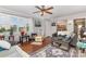 Cozy living room featuring hardwood floors, ample natural light, and stylish decor at 106 Rainbow Sw St, Concord, NC 28025