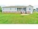 The backyard boasts a well-maintained lawn and patio, perfect for outdoor entertaining and relaxation at 110 Carol Lyn Dr, Kings Mountain, NC 28086
