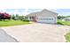Spacious driveway leading to a single-story home with a two-car garage and manicured landscaping at 110 Carol Lyn Dr, Kings Mountain, NC 28086