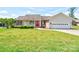 Charming single-story home with a well-manicured lawn, bright red door, and attached two-car garage at 110 Carol Lyn Dr, Kings Mountain, NC 28086