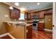 Modern kitchen with stainless steel appliances, granite countertops, and dark wood cabinets at 110 Carol Lyn Dr, Kings Mountain, NC 28086