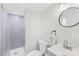 Cozy bathroom offers a shower, updated sink, and a floral hand towel at 1104 Venus St, Kannapolis, NC 28083