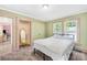Neutral bedroom boasts a wardrobe, window views, and a comfy bed at 1104 Venus St, Kannapolis, NC 28083