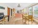 Bright dining area with wood flooring, adjacent to a kitchen with central island at 1104 Venus St, Kannapolis, NC 28083