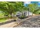 Inviting home with a front porch swing and mature landscaping at 1104 Venus St, Kannapolis, NC 28083