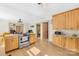 Well-lit kitchen with stainless steel oven, plentiful wood cabinets, and spacious countertops at 1104 Venus St, Kannapolis, NC 28083
