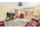 Cozy living room featuring hardwood floors, comfortable seating, and a view of the kitchen at 1104 Venus St, Kannapolis, NC 28083