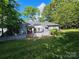 Private backyard featuring a charming patio area and lush greenery at 11216 Carmel Chace Dr, Charlotte, NC 28226