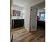 Stylish bathroom with dark vanity, framed mirror, and a view to the bedroom at 11216 Carmel Chace Dr, Charlotte, NC 28226