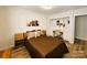Bright bedroom featuring built-in shelving, workspace, and stylish decor at 11216 Carmel Chace Dr, Charlotte, NC 28226