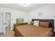 Well-lit bedroom boasts a large bed, neutral tones, and a flat screen television at 11216 Carmel Chace Dr, Charlotte, NC 28226