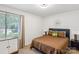 Cozy bedroom featuring carpet, ample natural light from the window, and a queen sized bed at 11216 Carmel Chace Dr, Charlotte, NC 28226