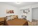 Comfortable bedroom featuring a built-in desk and shelving unit at 11216 Carmel Chace Dr, Charlotte, NC 28226