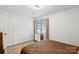 Bright bedroom featuring a closet with bi-fold doors and a window with exterior views at 11216 Carmel Chace Dr, Charlotte, NC 28226