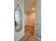 Open walk-in closet featuring wire shelves and a mirror leading to the bathroom at 11216 Carmel Chace Dr, Charlotte, NC 28226