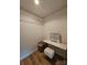 Walk-in closet equipped with wire shelves and a vanity for organization and functionality at 11216 Carmel Chace Dr, Charlotte, NC 28226