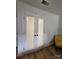 White closet doors with frosted glass panels are enhanced by black hardware at 11216 Carmel Chace Dr, Charlotte, NC 28226
