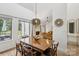Open dining room with large windows that flood the space with natural light at 11216 Carmel Chace Dr, Charlotte, NC 28226