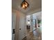 Inviting entrance that opens to a dining area and living room with lots of light from windows at 11216 Carmel Chace Dr, Charlotte, NC 28226