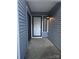 A clean entryway with gray siding at 11216 Carmel Chace Dr, Charlotte, NC 28226