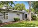A well-maintained home with gray siding, green lawn, and mature trees at 11216 Carmel Chace Dr, Charlotte, NC 28226