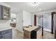 Open kitchen layout with a view to the dining area, featuring a kitchen island and modern appliances at 11216 Carmel Chace Dr, Charlotte, NC 28226