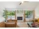 Inviting living room with a fireplace, large windows, and comfortable seating arrangements at 11216 Carmel Chace Dr, Charlotte, NC 28226