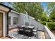 Outdoor patio area featuring a dining table and chairs on a patterned rug at 11216 Carmel Chace Dr, Charlotte, NC 28226