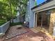 Outdoor patio with patterned rug and bench seating next to sliding door at 11216 Carmel Chace Dr, Charlotte, NC 28226