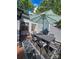 Outdoor dining area with table, chairs, umbrella and patterned outdoor rug at 11216 Carmel Chace Dr, Charlotte, NC 28226