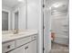 Bathroom with white cabinets and hardware, single sink, and tub/shower combo at 11931 The Ramble Dr, Huntersville, NC 28078